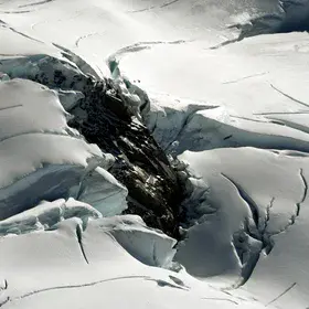 Rock knob surrounded by glacier ice