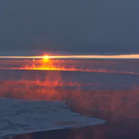 Sunset sea smoke, Antarctica